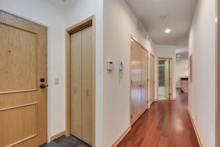 Hallway leading to Living Room, Dining Room Kitchen and Bath with the Luandry in the hall closet.