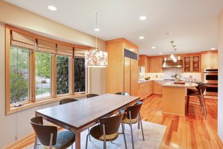 Open and bright kitchen area offers eat in space, as well as center island with additional seating.