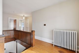 upper stairway with original wood floors through out