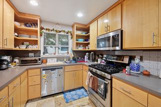Another view of kitchen.
Updated kitchen features Stainless Steel appliances and Custom Maple cabinets, Travertine Tile flooring. Lots of counter space.