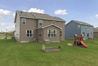 Back of the home, notice the home has gutters all the way around