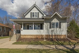 Maintenance free siding, Aluminum soffit, facia and gutters, brick accents with black shutters. 