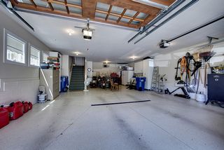 Extra deep garage, Heat, Sound, Floor coating, Stairs to main and lower level.