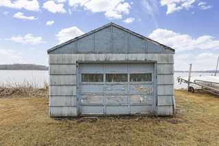 While this boat house is old and weathered it provides an opportunity with it's lakeside location for convenient lake toy storage.