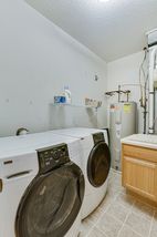 Laundry room with storage.