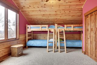 The Loft bedroom space is roomy, currently setup as a bunk area for the kids, large windows overlook the front yard area.