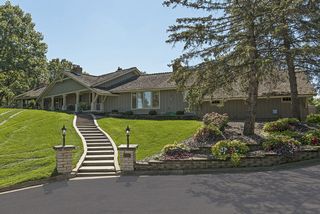 The walkway to the home is inviting and elegant.