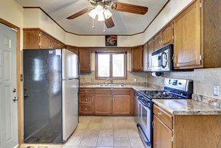 Updated kitchen with stainless steel appliances and sink.