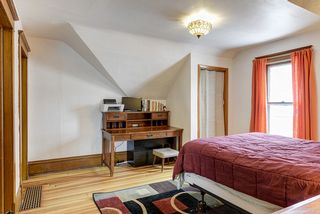 Upper 2nd bedroom.  Very spacious.  Vintage light.  Gorgeous hardwood floors.