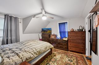 One of 2 bedrooms. Features Pine hardwood floors and ceiling fan.