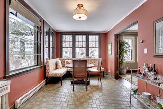 The Main Floor Sunroom is flooded with Natural Light and features Hand Made Tile Floors...