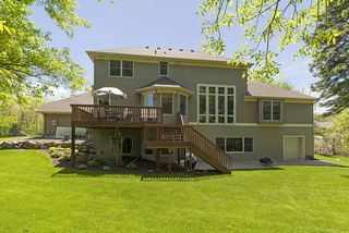 Large deck off the Kitchen, storage in lower garage area under the main floor garage.