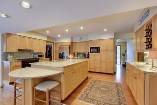 Granite counter-tops,  SS appliances and a wet bar!