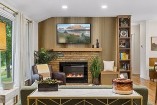 show stopping but not over-the-top with thoughtful updates like a new feature fireplace wall and bookcase blending with the refinished red oak hardwood