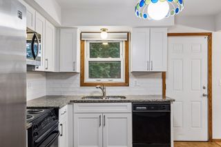 Window above sink to the spacious backyard