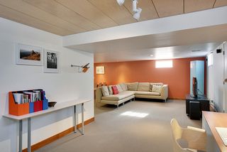 The finished Lower Level has plenty of space for an At-Home Office, Studio or additional Bedroom...