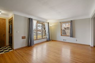 Front door with coat closet and two walls of windows
