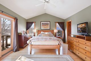 Master has private balcony, vaulted ceilings and hardwood floors