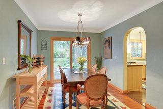 The Dining Room features a beautiful Chandelier, Hardwood Floors & Patio Doors that lead to the amazing Back Yard! 