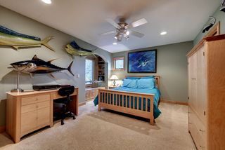 Bedroom 4 upstairs with adjoining private bath, window seat, and built ins.