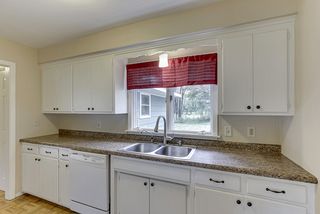Kitchen has a wide open view of the back yard