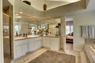 Luxury marble bath also has a vaulted ceiling with cove lighting!