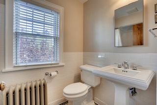 Upper level full bath - subway tile, newer toilet and sink. 