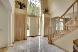 Sun - filled Entry way to greet your guests. Flanking Entry closets with ceramic tile flooring.