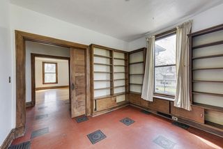 The Main Floor Den/Library features walls of Built-In Bookcases! 