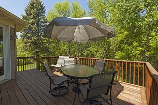 Beautiful wooded backyard area make this a private retreat.