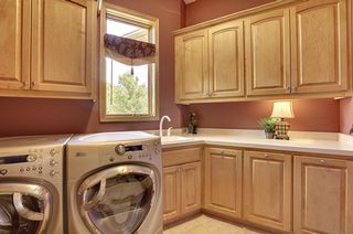 Laundry room with great storage and pull out laundry bins