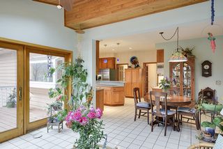 Step out to the inviting deck from you beautiful sun porch...