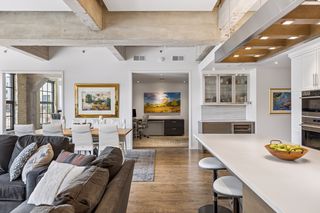 The renovation added a spacious office space for two with frosted glass pocket doors.