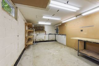 Workshop has the potential to be converted to a third bedroom by adding an egress window. Newly drain tiled with sump pump installed.