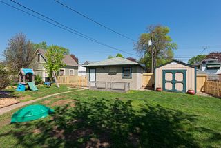 Backyard, view of garage and garden shet