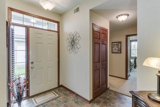 Sidelight & transom, embrace the front entry. Convenient front coat closet. 