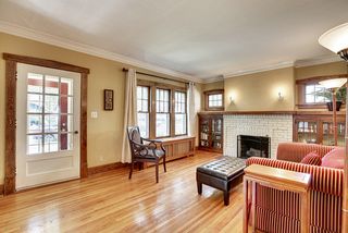 The Living Room features gleaming Hardwood Floors & Fireplace! 
