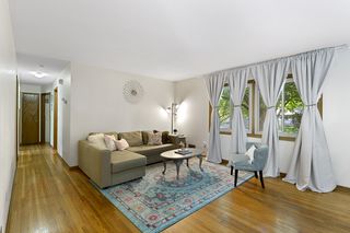 Living Room w/ Gleaming Hardwood Floors & Natural Light