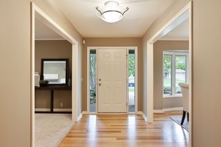 ...into the sunlit front entryway with Tzamanian Oak flooring 