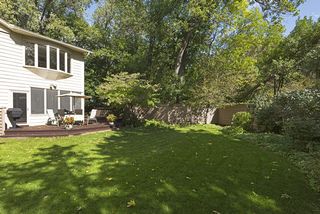 Side Yard with bow window above from Owners' Suite!