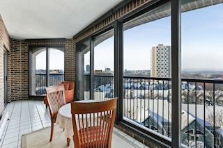 Vast Three-Season Porch with magnificent north and west facing views of Loring Park, The Walker and sunsets.