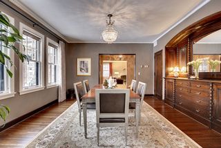 The Light-Filled Formal Dining Room features a stunning Built-In Buffet...
