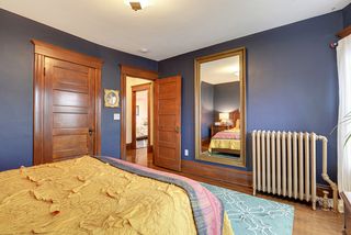 Bedroom #1 features Hardwood Floors & Rich Woodwork! 