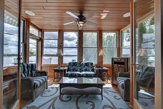Gorgeous 3 season porch, cedar ceiling and walls. Andersen doors leading to sitting room.
