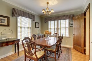 The Elegant Dining Room features Built-In China Cabinet & Hardwood Floors...