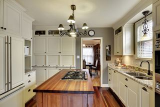 This is a Chef's DREAM! Sub-Zero Refrigerator, Custom Cabinets & Wolf Ovens...