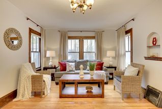 Absolutely lovely living room with three large windows and functional, open layout.