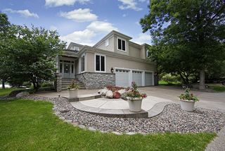 Soft California styled home with natural stone and stucco exterior.