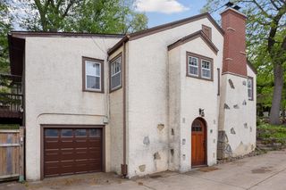 One car Garage  and entrance to the large backyard and extensive decking
