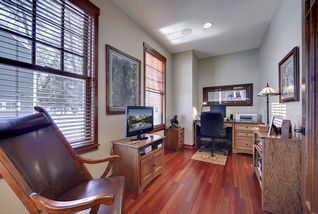 Main floor Office/Den area with craftsmen style glass doors for privacy.